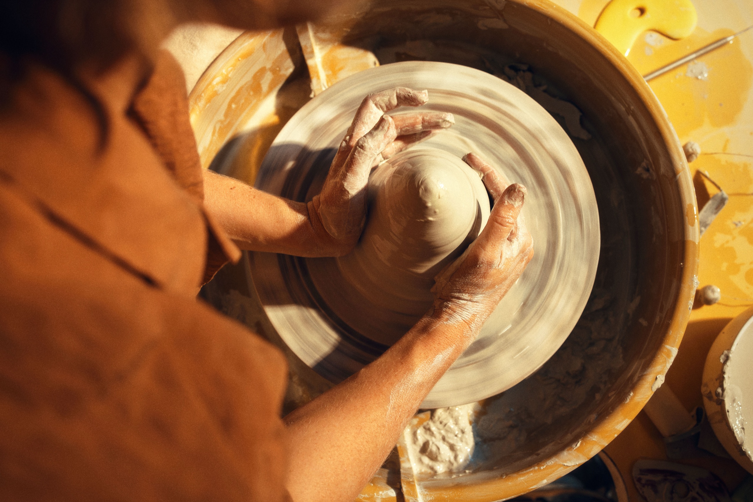 A potter's wheel mid-throw